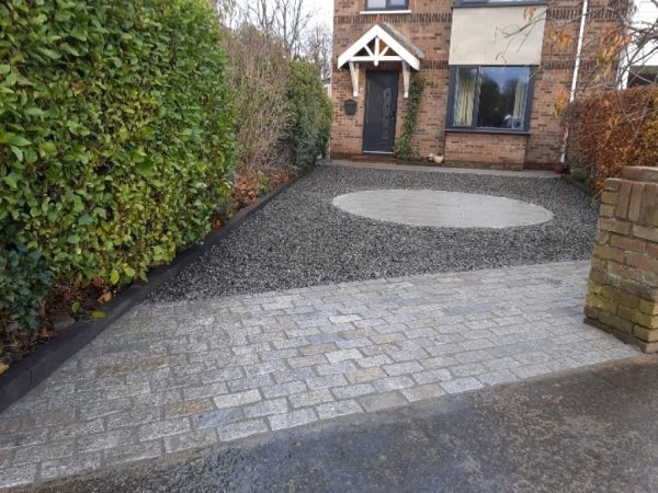 Gravel being laid on a driveway in Annascaul