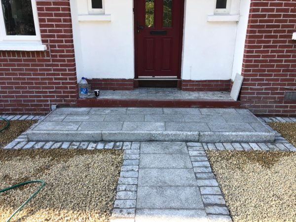 Gravel being laid on a driveway in Fenit